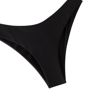Detail of black seamless bikini bottoms showing high-quality fabric texture and stitching