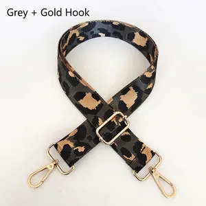 Adjustable leopard print nylon bag strap in grey with gold metal swivel hooks and buckle
