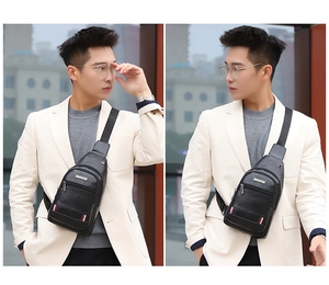Detailed view of black leather chest bag with signature tricolor stripe and metal zipper