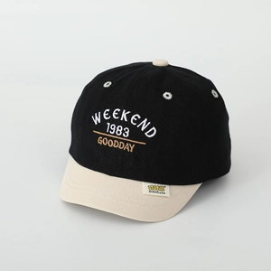 Close-up of contrast color cotton baseball cap with weekend embroidery and soft brim
