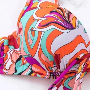 Floral print bikini top with pleated cups and bohemian graffiti pattern in vibrant colors