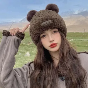 Plush brown bear ear knit hat for women featuring thick thermal lining and leather tag