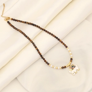 Natural stone beaded necklace with a colorful zircon elephant pendant on white silk