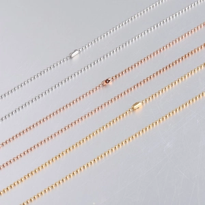 Detailed view of 1.5mm stainless steel bead chains in silver, rose gold, and gold colors