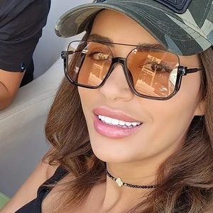Fashionable oversized double bridge sunglasses with brown gradient lenses on model