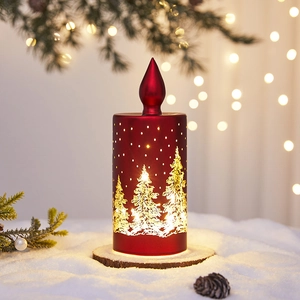 Red Christmas LED candle lamp with golden tree patterns on snow-covered wood base