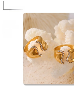 Macro detail of irregular 18k gold plated stainless steel ring with pavé crystals