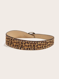 Close-up detail of leopard print belt with silver studs and a classic metal buckle