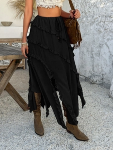 Detail view of high waist black skirt featuring layered ruffles and drawstring lace-up waist