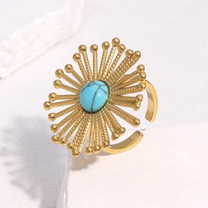 Bohemian gold plated sunburst open ring with turquoise stone and radial metal pattern