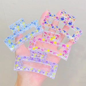 Floral print transparent acrylic hair claw clips in blue, pink and purple for women