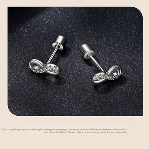 Macro shot of S925 sterling silver infinity earrings with micro-inlaid moissanite stones