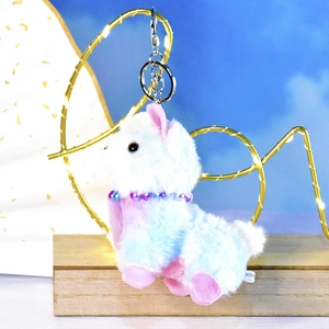 Cute colorful rainbow plush animal keychain charm for school bags and handbags.