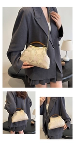 Three views of a champagne embroidered frame bag with floral details and amber handle