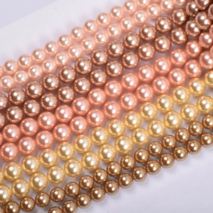 Macro detail of high-luster multicolored glass pearl beads for handmade jewelry