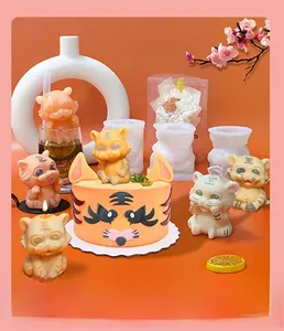 DIY silicone mold for cute tiger jelly and cartoon pudding crafts on orange background