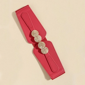 Detail view of red elastic waist belt with four interlocking golden coin metal ornaments