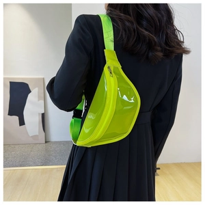 Detail of neon green transparent PVC chest bag with matching adjustable nylon strap