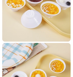 Detailed view of assorted 5cm miniature resin dessert bowls with mango and red bean toppings