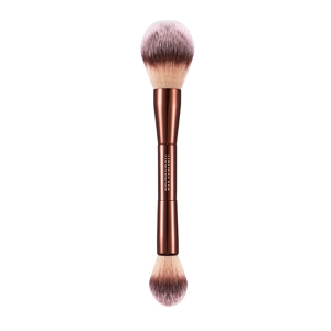 Double-ended makeup brush with bronze metal handle and soft synthetic bristles for face.