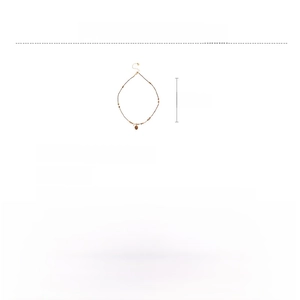 Detail showing gold beaded tiger's eye necklace with zircon stones and adjustable chain length