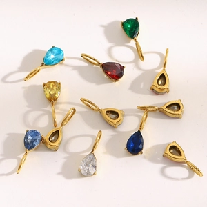 Macro detail of pear-shaped colorful birthstone charms in 18K gold-plated stainless steel