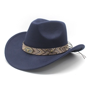 Detail of navy wool felt cowboy hat featuring vintage woven band and bull head metal buckle