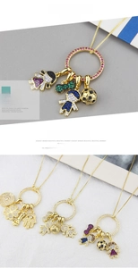Detailed close-up of gold-plated necklaces with colorful zircon figure charms
