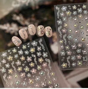 Detail showing dopamine floral nail stickers with 3D pearls and colorful butterfly designs