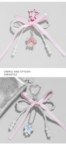 Detail of pink ribbon bow charms with heart stars and faux pearl beads for bags
