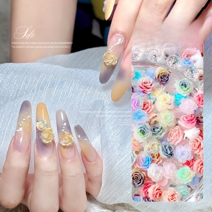 Detail showing colorful soft resin lotus flowers for nail art with pearlescent finish