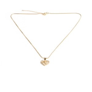 Detailed view of golden heart-shaped necklace with a crystal dolphin pendant inlay