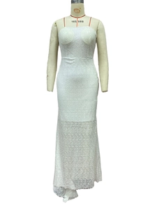 Detail of white lace evening gown featuring delicate sequins and fine floral embroidery