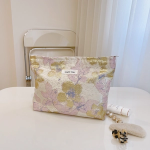 Trousse à maquillage jacquard florale bleu clair et rose avec fermeture éclair dorée