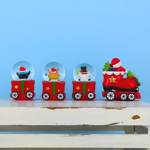 Close-up of a 4-piece red Christmas train snow globe set featuring Santa and snowman