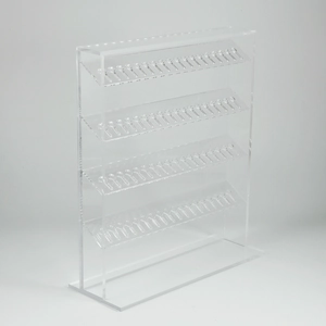 Transparent four-tier acrylic display stand with multi-hole design for jewelry on white background