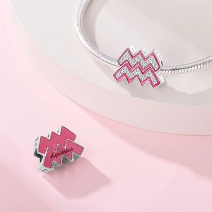 Pink Aquarius charm detail with silver metal plating and sparkling zircon inlay
