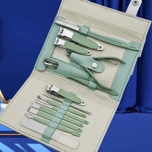 12-piece stainless steel manicure set in sage green and cream foldable leather case