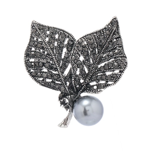 Vintage silver leaf brooch with black rhinestones and a grey metallic pearl
