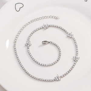 Detailed view of silver flower tennis necklace with zircon inlay and adjustable clasp