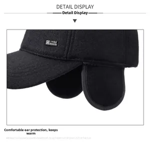 Detail view of winter baseball cap with ear flaps and 1988 FASHION logo for warmth