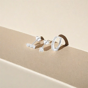 Close-up of S925 sterling silver hoop earrings set with sparkling cubic zirconia stones