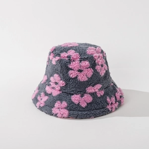 Close-up of gray lamb fleece bucket hat with pink floral pattern and soft texture