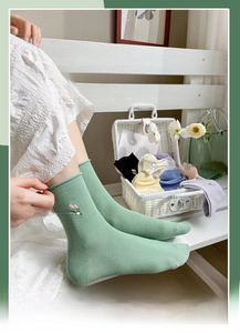 Detail of cotton crew socks set featuring floral embroidery in macaron colors