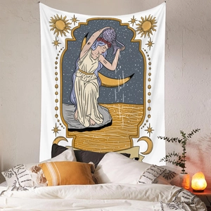 Detail of bohemian zodiac tapestry showing Aquarius goddess motif over a cozy bed
