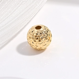 Golden S925 sterling silver faceted round bead with textured finish and center hole