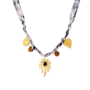 Golden sun pendant necklace with animal print fabric cord and heart-shaped charms
