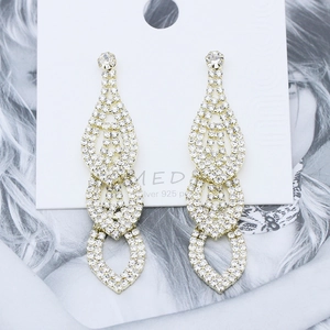 Luxurious gold-plated drop earrings with layered crystal teardrops for bridal wedding wear