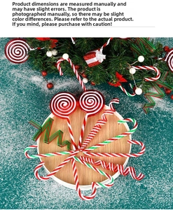 Close-up of red, white, and green spiral lollipop and candy cane Christmas ornaments