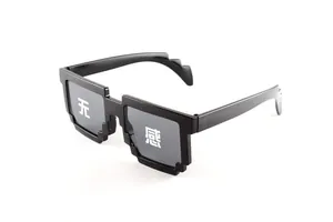 Detail of black pixel-style sunglasses featuring retro 8-bit frame design and grey lenses